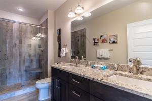 a bathroom with a sink and a shower and a toilet at Sail Lofts by Summit County Mountain Retreats in Dillon +37 photos