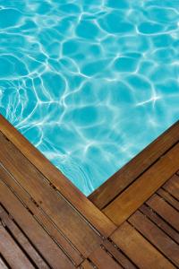a close up of a pool with blue water at FLH Mouraria Art Apartment with Pool in Lisbon