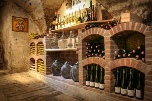 a wine cellar with a bunch of bottles of wine at Hinterburghof in Saalfelden am Steinernen Meer