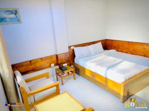 Ein Bett oder Betten in einem Zimmer der Unterkunft Royal Village Hotel