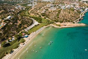 an aerial view of a beach with boats in the water at Aris House - Cretan Hospitality in Agios Nikolaos