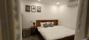 Postel nebo postele na pokoji v ubytování Hoang Phuc resort
