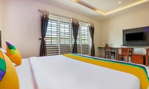Postel nebo postele na pokoji v ubytování Itsy Hotels Kottaram Residency + 28 fotografií
