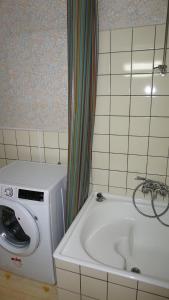 a washing machine and a washer in a bathroom at Plantin Apartment in Antwerp +22 photos