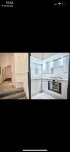 a kitchen with white cabinets and a stove top oven at Historic Grade 2 listed, Town centre, St.Neots Cambridgeshire in Hail Weston