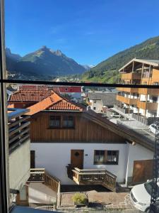 a view of a building with mountains in the background at Bella Stubai in Fulpmes