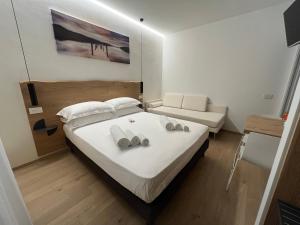 Postel nebo postele na pokoji v ubytování Civitaloft Luxury Rooms