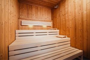 a wooden sauna with a wooden bench in it at SeeLoge Eutin in Eutin