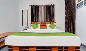 Postel nebo postele na pokoji v ubytování Treebo Alaka Rester Homestay + 21 fotografií