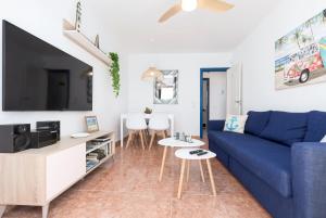 A television and/or entertainment centre at Home2Book Casa La Pepita 2