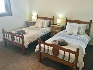 Katil atau katil-katil dalam bilik di Cluaran Cottage