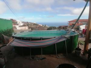 a large bath tub with a hammock in front of it at Studio Canario in El Escobonal
