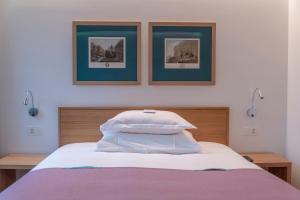 Ein Bett oder Betten in einem Zimmer der Unterkunft CASPAR Swiss Quality Hotel