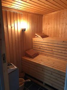 a wooden sauna with two twin beds in it at Seterhytte i Havsdalen in Geilo