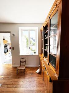 a living room with a window and a wooden floor at Villa Sainte Claire in Saint Malo