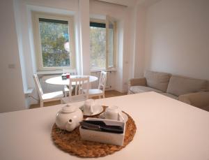 a living room with a tea set on a table at Olimpico deluxe apartment in Rome