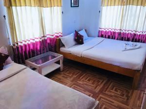 Voodi või voodid majutusasutuse Hotel Buddha Land toas