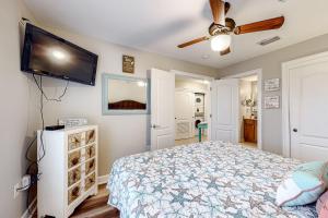 a bedroom with a bed and a flat screen tv at The Indies #503 in Fort Morgan