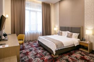 Rúm í herbergi á Sphera by Stellar Hotels, Yerevan