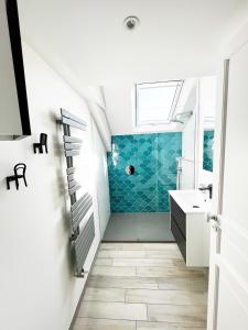 a bathroom with a sink and a shower at Villa Sainte Claire in Saint Malo