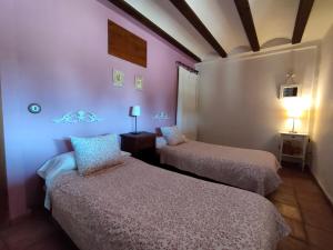 Postel nebo postele na pokoji v ubytování Masia los Toranes - Destino Starlight