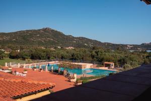 a view of a swimming pool with mountains in the background at Casa Gallo in Santa Marinella