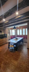 a large dining room with a large table and chairs at Casa Robelca in Biescas