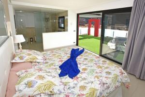 A bed or beds in a room at Villa Morro del Guincho 27