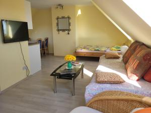 a living room with a couch and a table at Anam Sona SeaView B&B in Caherkeen