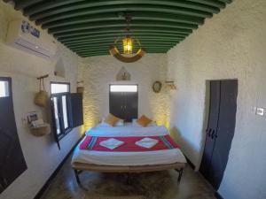 Postel nebo postele na pokoji v ubytování SAMA Wakan Heritage Homes
