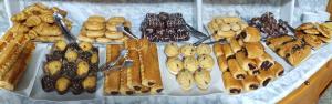 a bunch of different types of pastries on a table at Hotel VIDA Playa Paxariñas in Portonovo