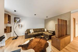 a living room with a couch and a table at Apartment Ub31 One in Eggen