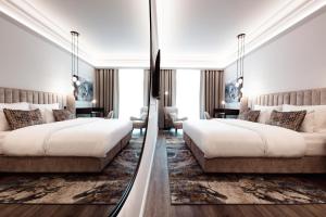 Postel nebo postele na pokoji v ubytování O11 Boutique Hotel Vienna