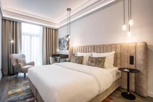 Postel nebo postele na pokoji v ubytování O11 Boutique Hotel Vienna