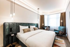 Postel nebo postele na pokoji v ubytování O11 Boutique Hotel Vienna
