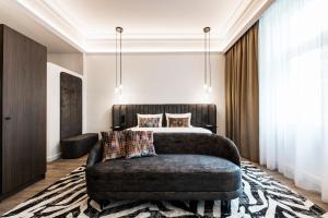 Postel nebo postele na pokoji v ubytování O11 Boutique Hotel Vienna
