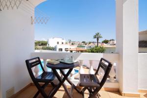 a table and chairs on a balcony with a view at Apartamentos Arcadia - Ana in Guia