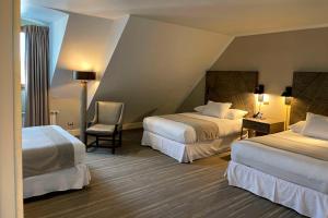 Letto o letti in una camera di Hotel Cabo De Hornos