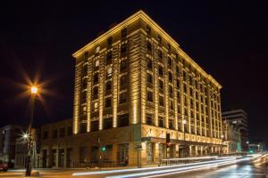 a large building on a city street at night at Hotel Cabo De Hornos in Punta Arenas