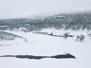 a train in the snow on a mountain at Sorrisniva Arctic Wilderness Lodge in Alta