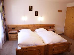 Postel nebo postele na pokoji v ubytování Lärchenhof