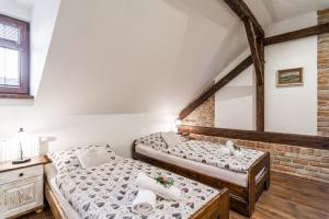 Posteľ alebo postele v izbe v ubytovaní Apartmány in Veritas