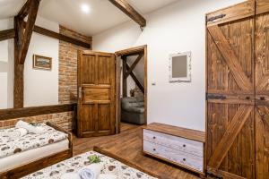 Posteľ alebo postele v izbe v ubytovaní Apartmány in Veritas