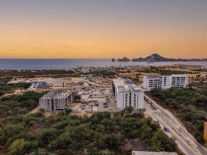 an aerial view of a city with buildings and the ocean at Endless Summer - 2Bed 2Bath Condo - Seasonly Heated Pool with Ocean Views - 5min walk to Beach - Fibre Internet - Sleeps 6 in Cabo San Lucas