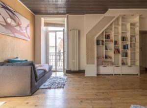 a living room with a couch and a staircase at gite cosy et moderne au coeur des pyrénées 