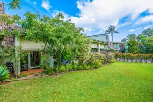an image of a house with a yard at Puamana 9B in Princeville