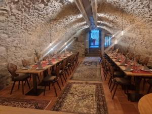 a long dining room with long tables and chairs at Hotel Lafette in Hinterzarten