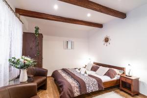 Posteľ alebo postele v izbe v ubytovaní Apartmány in Veritas