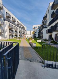 an empty walkway between two apartment buildings at Apartments Franny's Bees in Vilnius