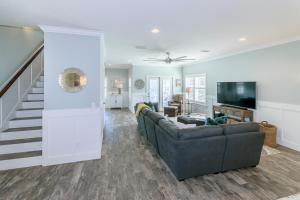 a living room with a couch and a television at Near The Mayo Clinic 2 Blocks From Ocean 4 Bedroom Pet Friendly Home in Jacksonville Beach